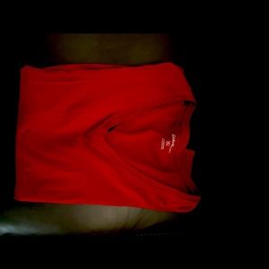 Red tee shirt with white heart on it